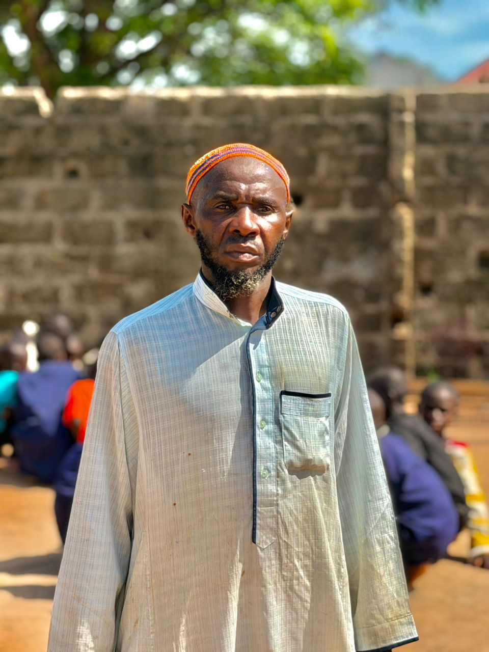 Sheikh Musa Saidy standing with students of the Daara behind him